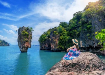 beautiful-girl-sitting-rock-phuket-thailand