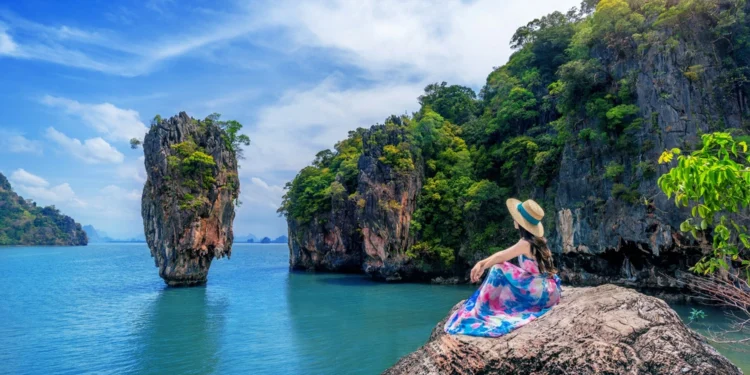 beautiful-girl-sitting-rock-phuket-thailand